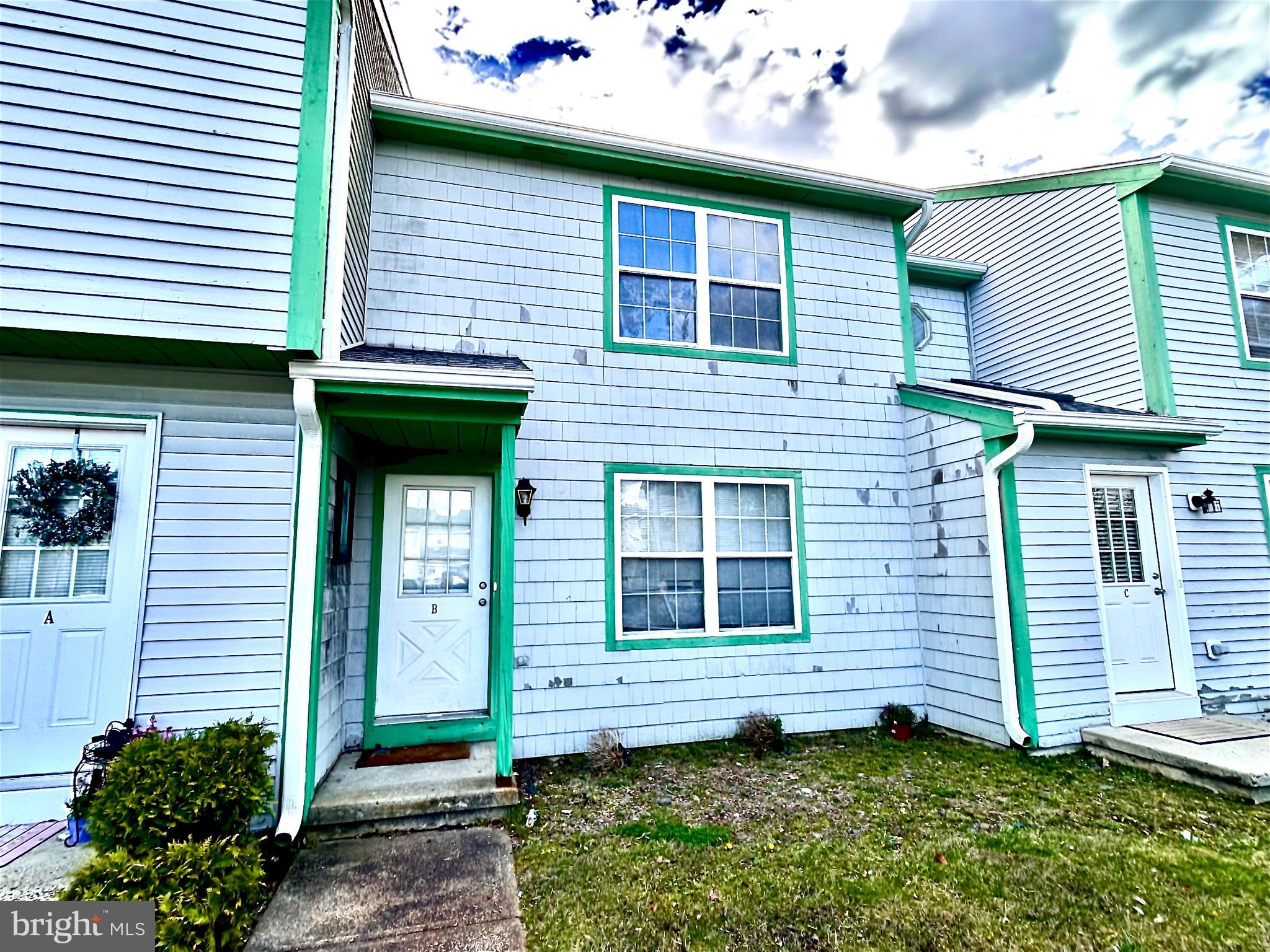 5 Oyster Bay Road Absecon, NJ 08205 - Photo 1 of 15 a view of a house with potted plants and a chair