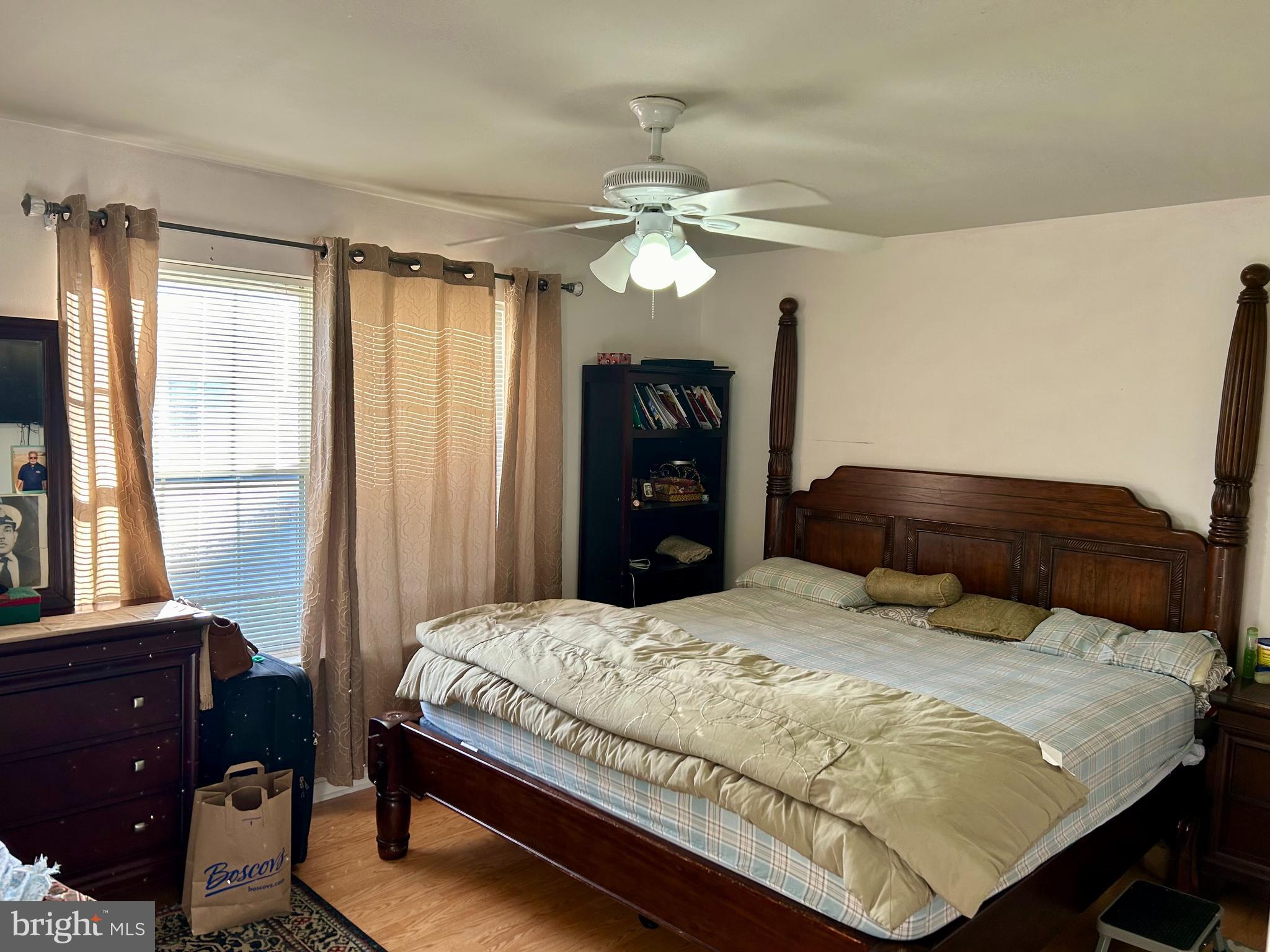 5 Oyster Bay Road Absecon, NJ 08205 - Photo 11 of 15 a bedroom with a bed and wooden floor