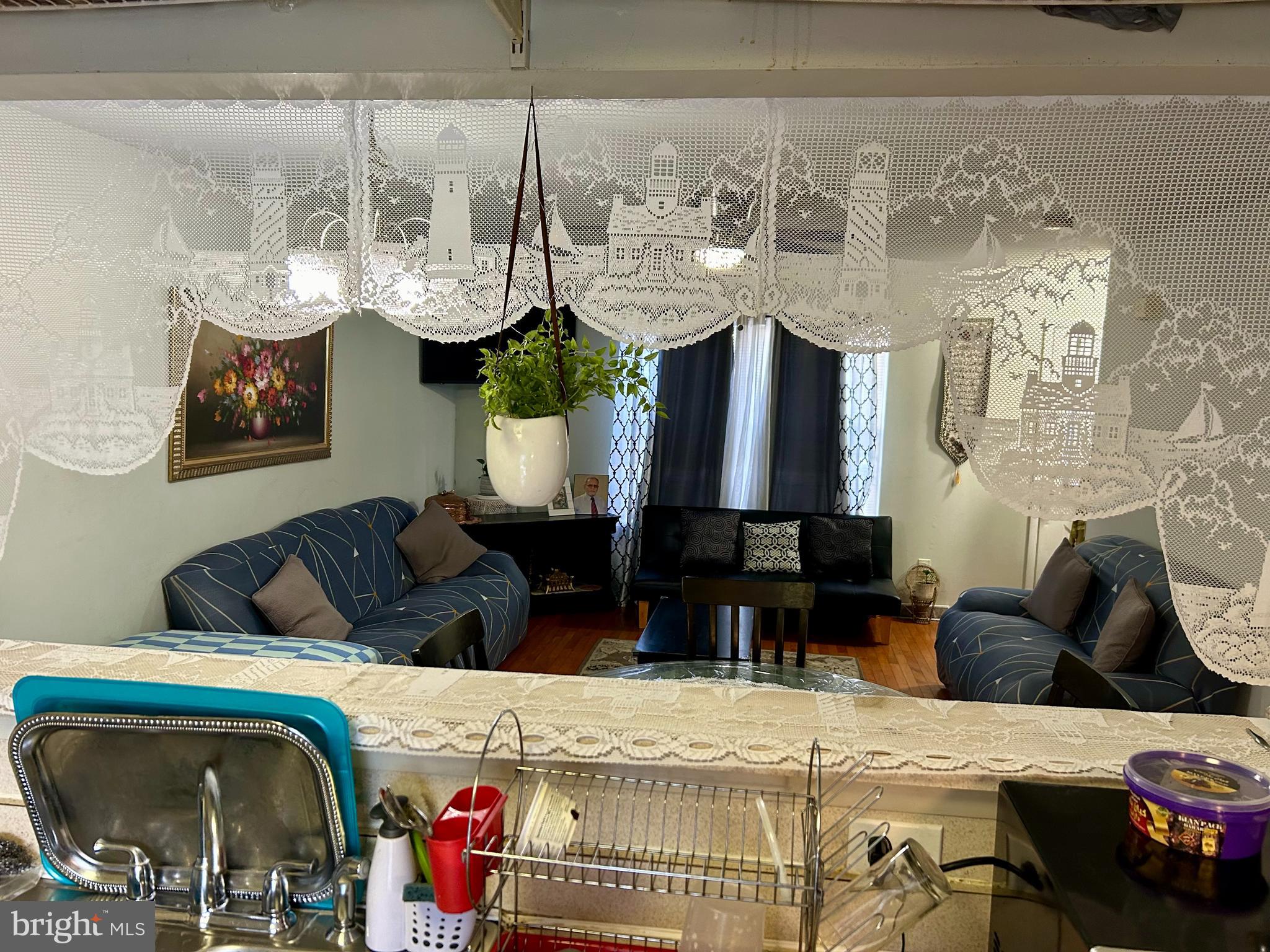 5 Oyster Bay Road Absecon, NJ 08205 - Photo 4 of 15 a living room with furniture and a chandelier