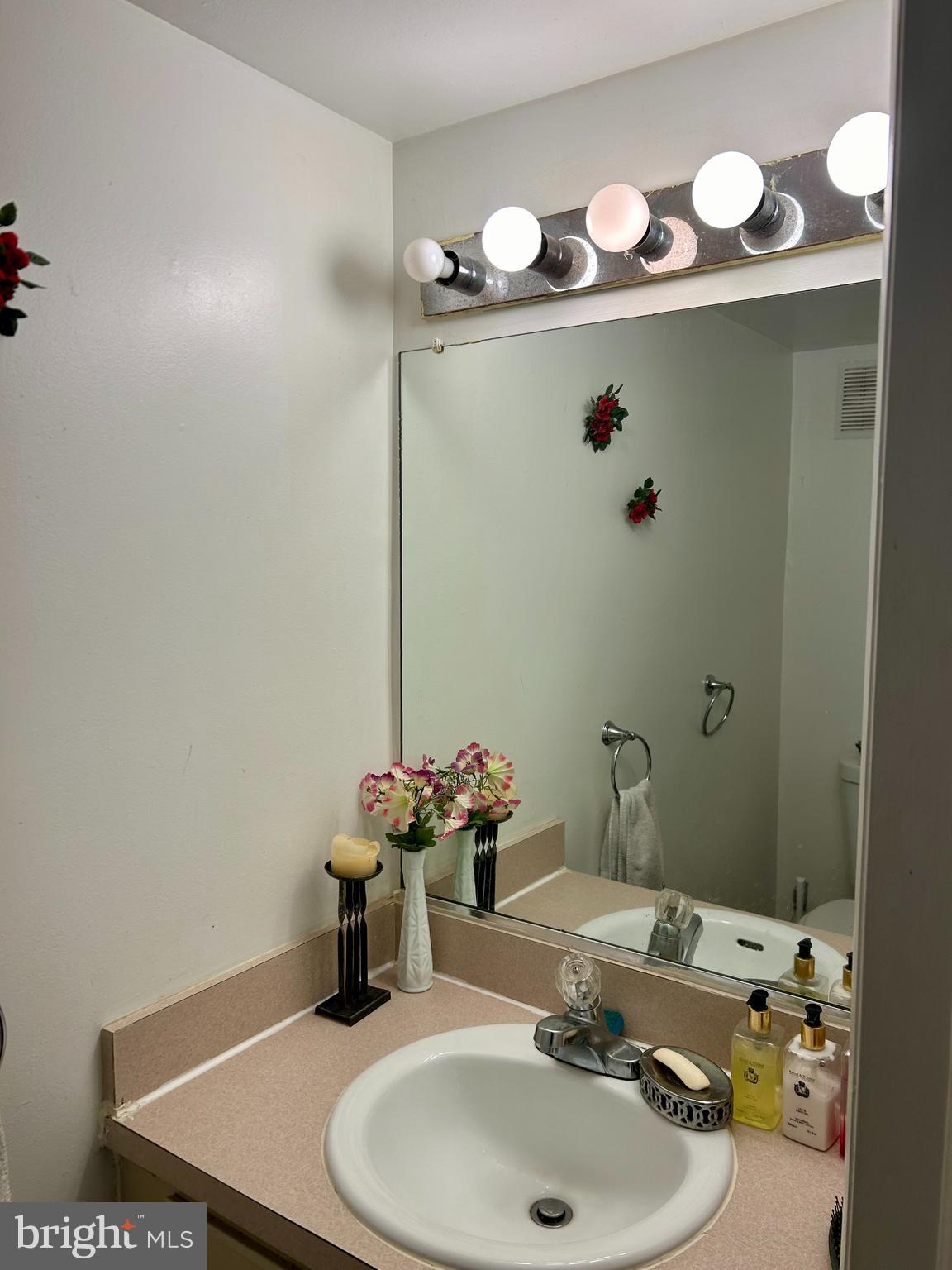 5 Oyster Bay Road Absecon, NJ 08205 - Photo 5 of 15 a bathroom with a sink and a mirror