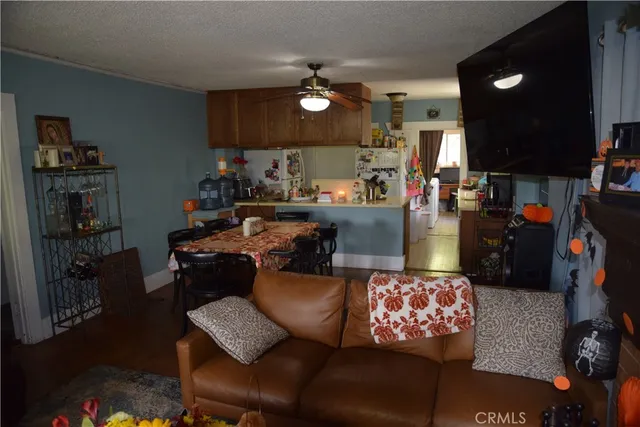 a living room with furniture and a lamp