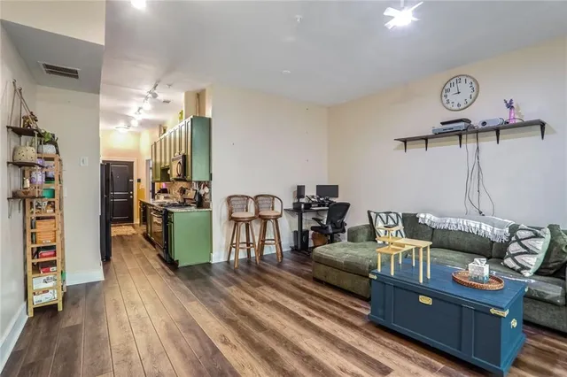 a view of a dining room with furniture and wooden floor