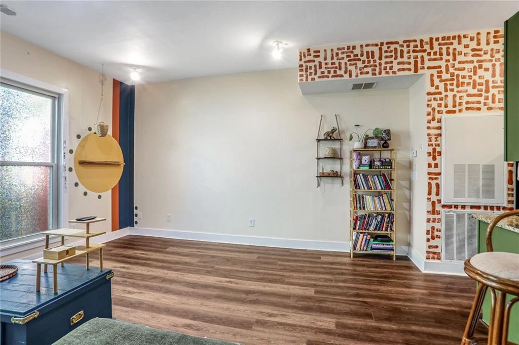 1195 Milton Terrace Southeast, Unit 2203 Atlanta, GA 30315 - Photo 3 of 16 a view of a livingroom with furniture and a window