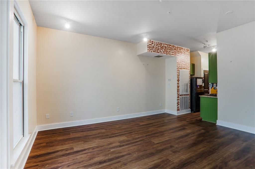 1195 Milton Terrace Southeast, Unit 2203 Atlanta, GA 30315 - Photo 5 of 16 a view of a hallway with wooden floor