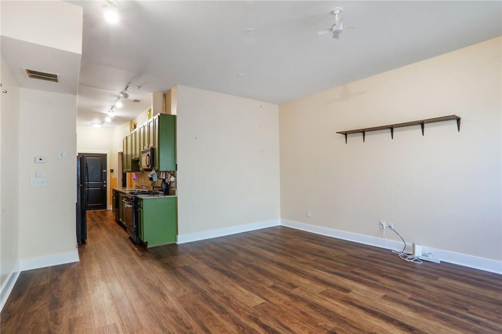 1195 Milton Terrace Southeast, Unit 2203 Atlanta, GA 30315 - Photo 6 of 16 a view of a room with wooden floor