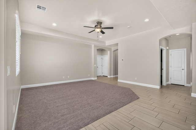 11 East 640 South Ivins, UT 84738 - Photo 12 of 44 Recessed lighting, ceiling fan, arched doorways, wood-finish flooring, and neutral wall tones