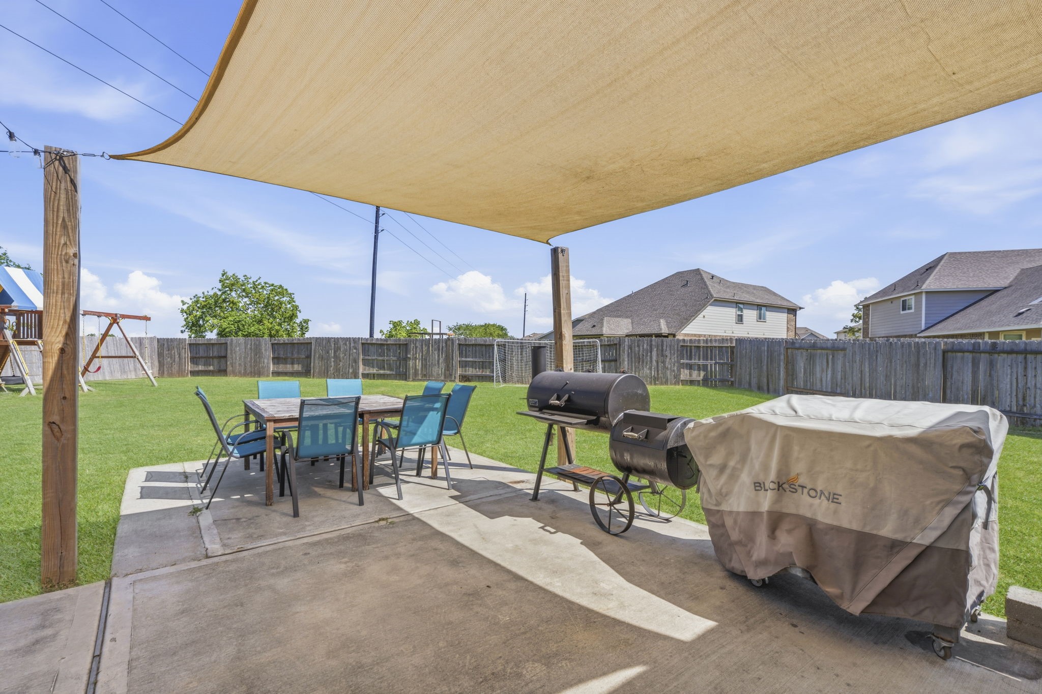 2401 Abbot Brk Drive Rosharon, TX 77583 - Photo 37 of 50 This space is perfect for lounging and enjoying the sights and sounds of nature while waiting for the grill to heat up or relaxing with a cold drink in hand. As the sun sets over the greenbelt, you can take in the breathtaking views of nature, making this outdoor area the ideal spot for unforgettable evenings with family and friends.
