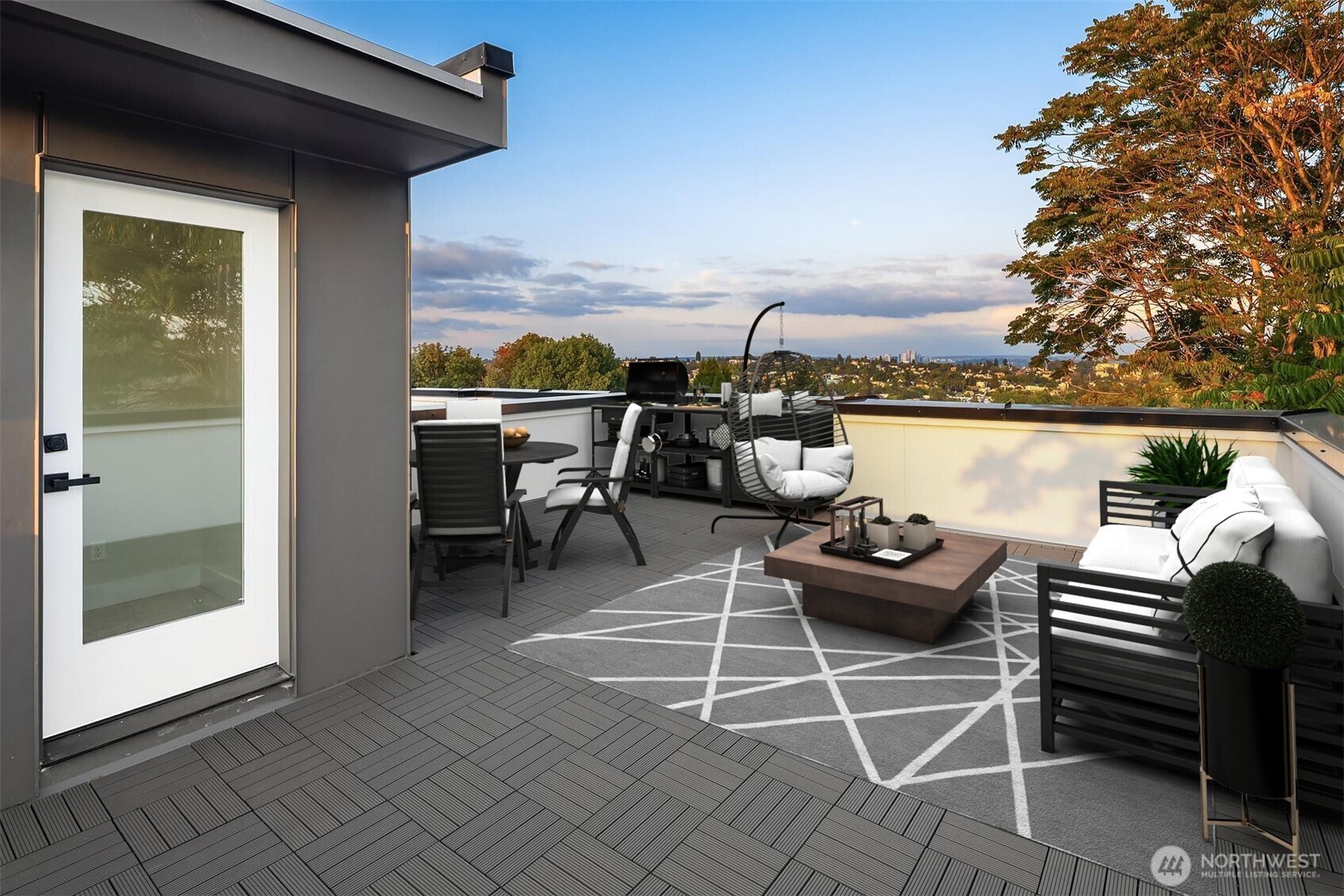 1319 14th Avenue South, Unit A Seattle, WA 98144 - Photo 18 of 27 a view of a balcony with chairs and a potted plant