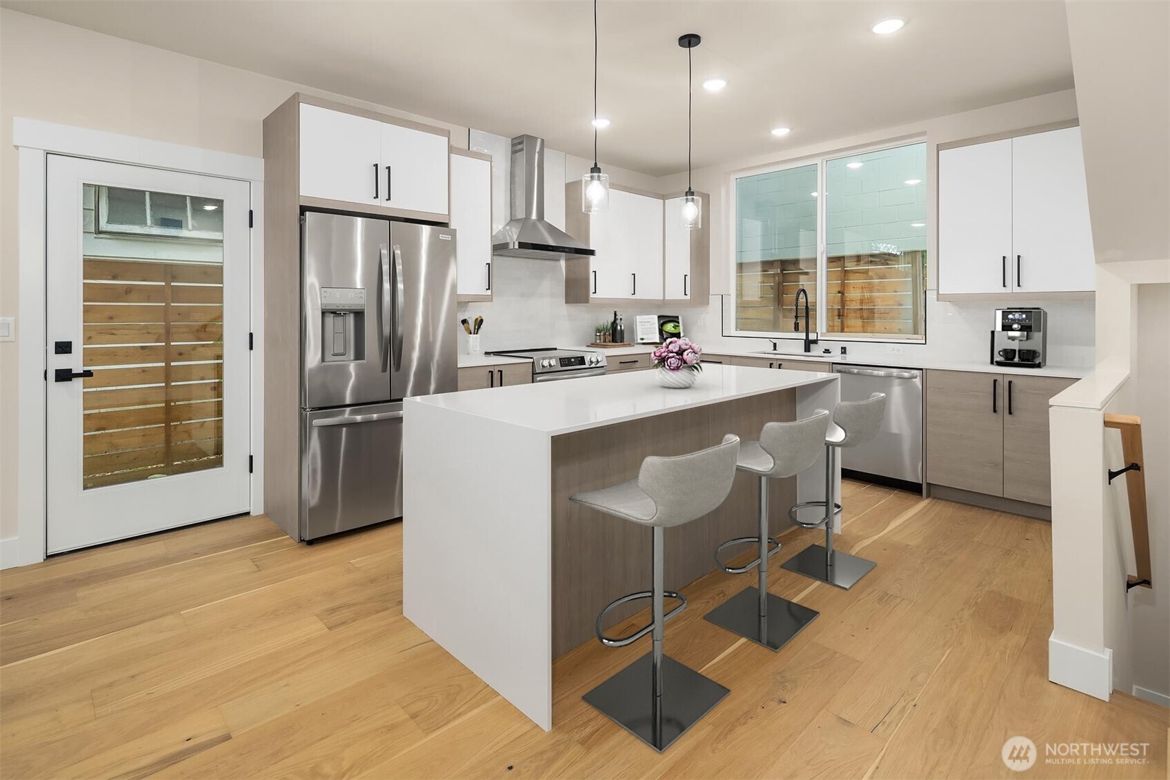 1319 14th Avenue South, Unit A Seattle, WA 98144 - Photo 7 of 27 a kitchen with refrigerator cabinets and wooden floor