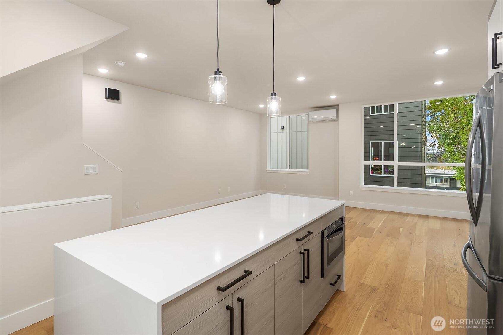 1319 14th Avenue South, Unit A Seattle, WA 98144 - Photo 8 of 27 a view of a kitchen with a sink and dishwasher with wooden floor