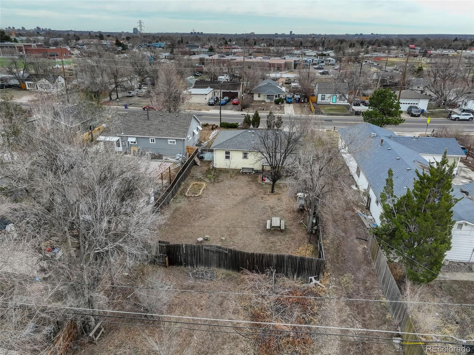 1065 South Irving Street Denver, CO 80219 - Photo 4 of 4 an aerial view of a house with a yard