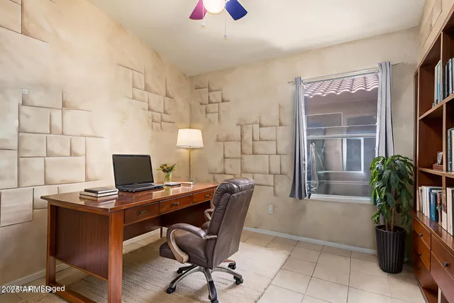 a workspace with furniture and a potted plant