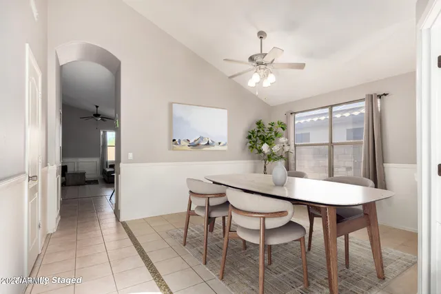 a dining room with furniture and window