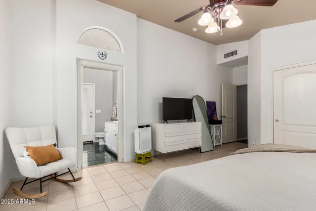 a bedroom with a bed and furniture