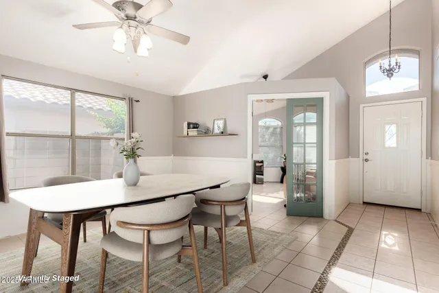 a view of a dining room with furniture and window