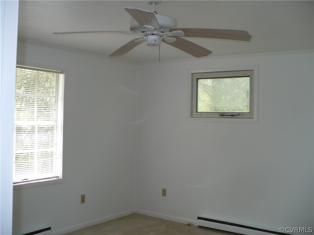 2886 Bethany Church Road Bumpass, VA 23024 - Photo 10 of 18 an empty room with windows and fan