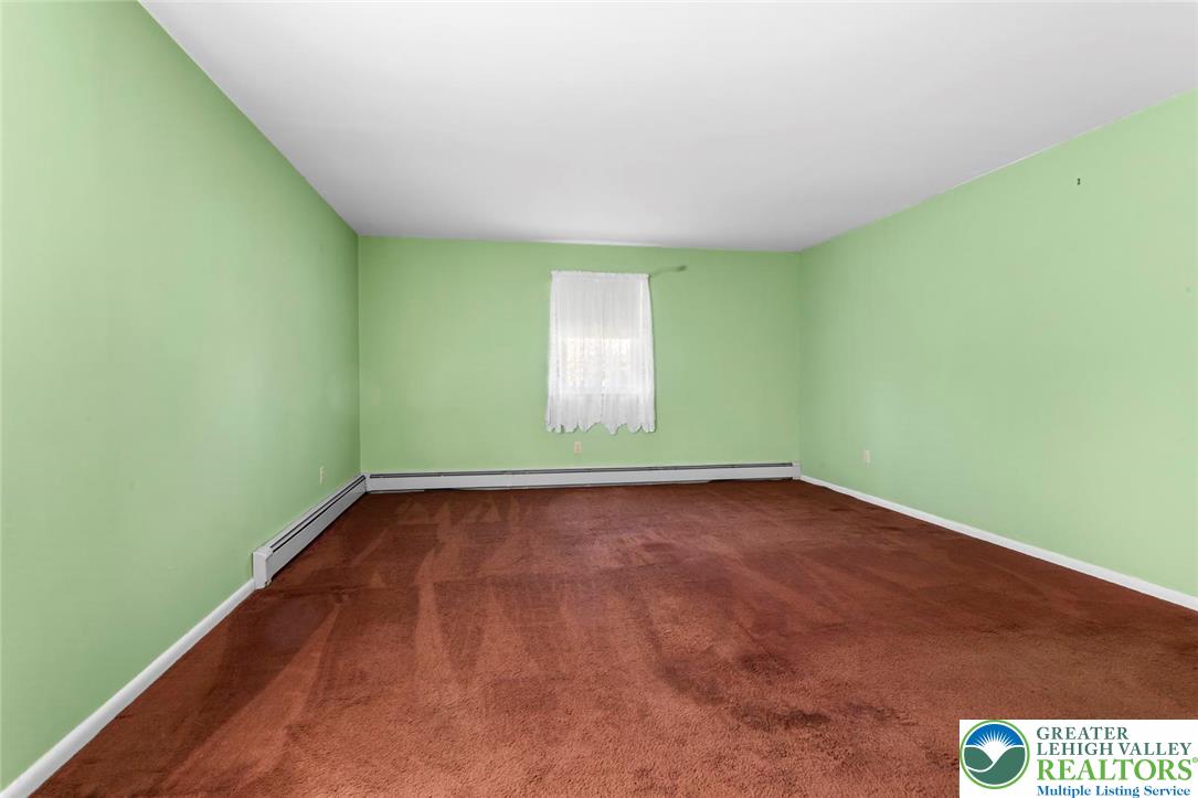919 Breidinger Road Nazareth, PA 18064 - Photo 14 of 33 a view of an empty room with a window and wooden floor
