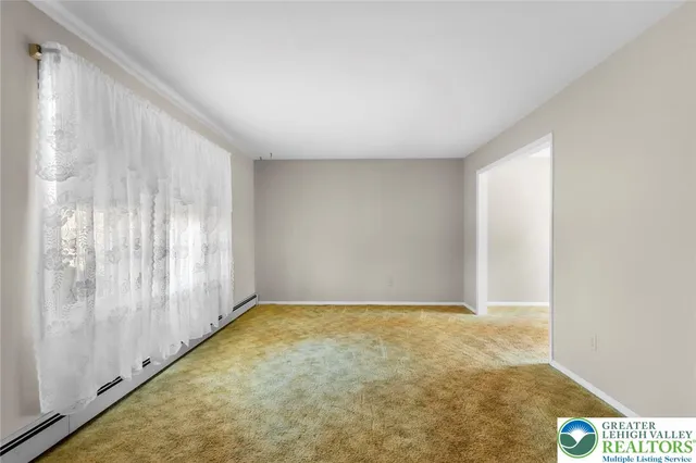 a view of an empty room and window