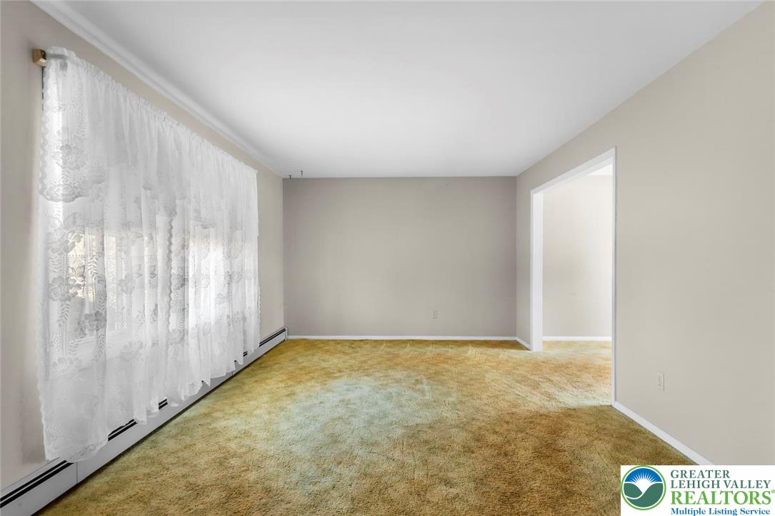 919 Breidinger Road Nazareth, PA 18064 - Photo 3 of 33 a view of an empty room and window