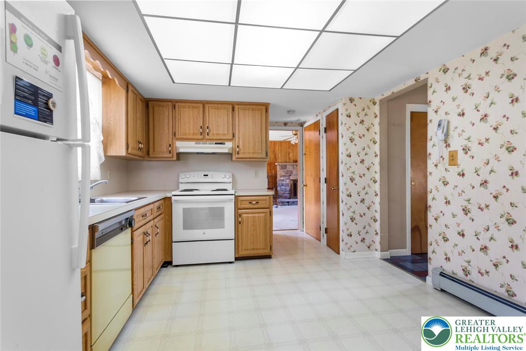 919 Breidinger Road Nazareth, PA 18064 - Photo 5 of 33 a kitchen with stainless steel appliances a stove a sink and a refrigerator