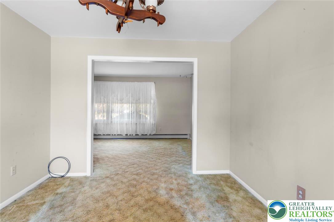 919 Breidinger Road Nazareth, PA 18064 - Photo 8 of 33 a view of a room with wooden floor and mirror