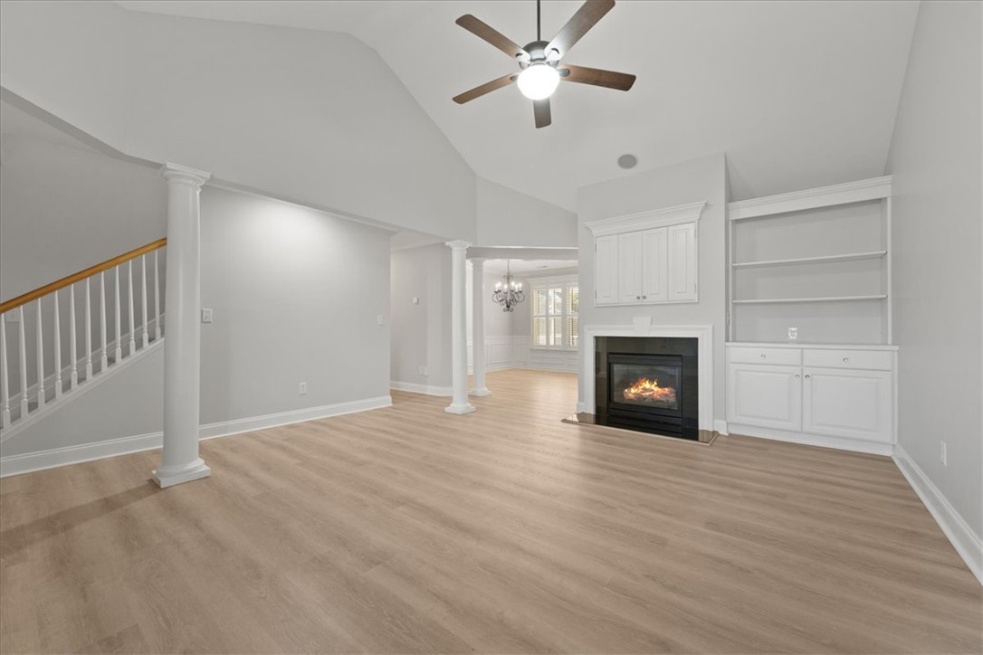 100 Shipyard Circle Anderson, SC 29621 - Photo 5 of 40 This airy living space features a warm fireplace, creating an inviting atmosphere.
