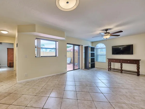 a view of a livingroom with furniture and a window
