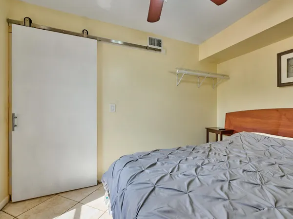 a bedroom with a bed and a shower