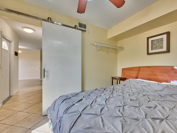 a bedroom with a bed and a shower