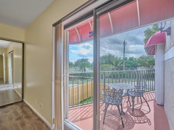 a front view of a house with lake and outdoor space