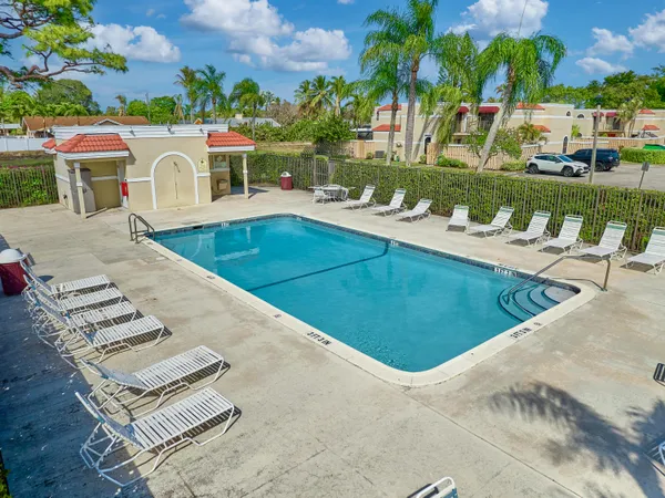 a view of a chairs and table in patio