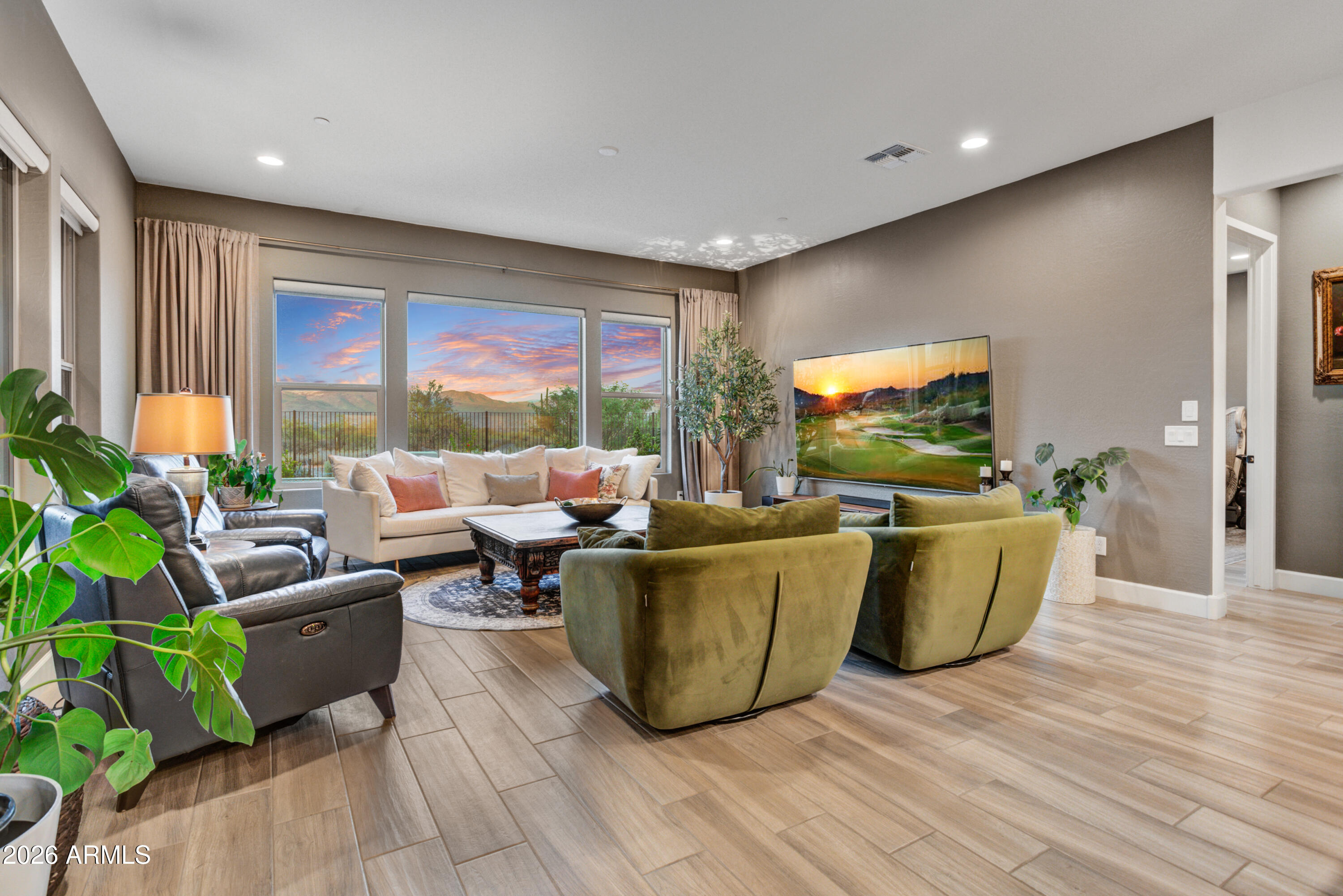 28517 North Camel Rock Court Rio Verde, AZ 85263 - Photo 12 of 39 a living room with furniture a large window and a flat screen tv