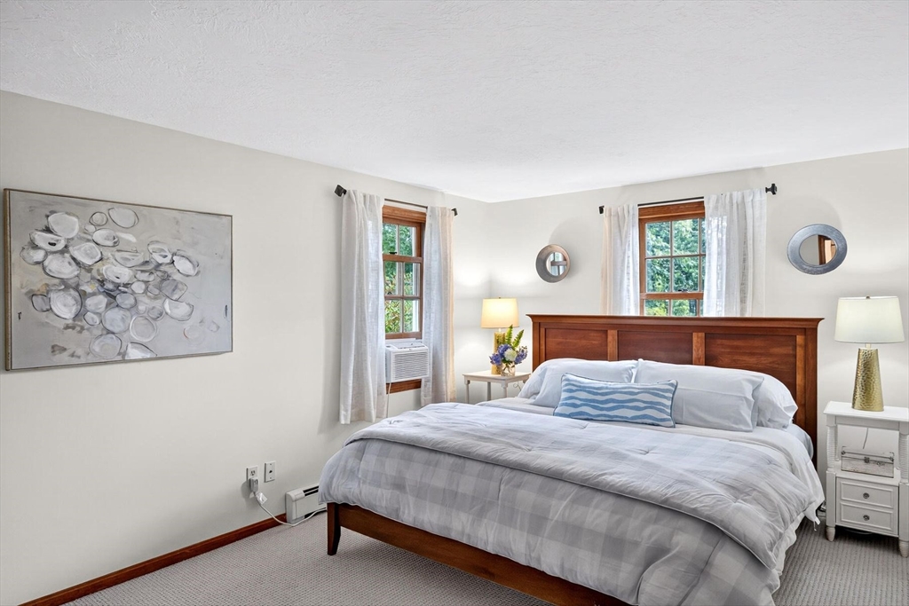 12 Tracy Road Barnstable, MA 02635 - Photo 19 of 42 a bedroom with a large bed and a window