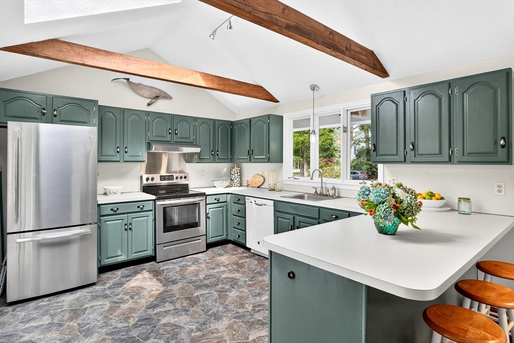 12 Tracy Road Barnstable, MA 02635 - Photo 24 of 42 a kitchen with a sink cabinets and stainless steel appliances
