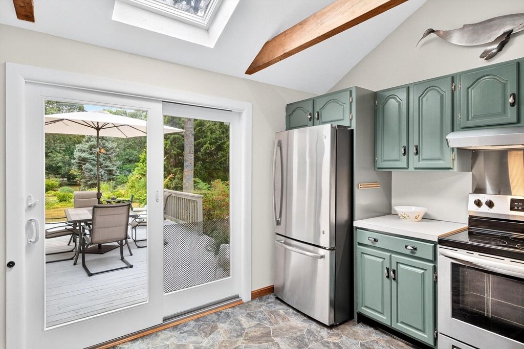 12 Tracy Road Barnstable, MA 02635 - Photo 27 of 42 a kitchen with stainless steel appliances granite countertop a refrigerator and a stove