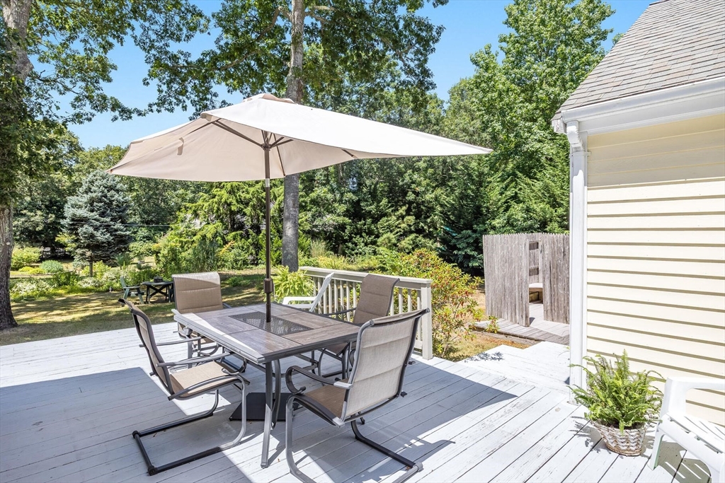 12 Tracy Road Barnstable, MA 02635 - Photo 28 of 42 a patio with wooden floor table and chairs
