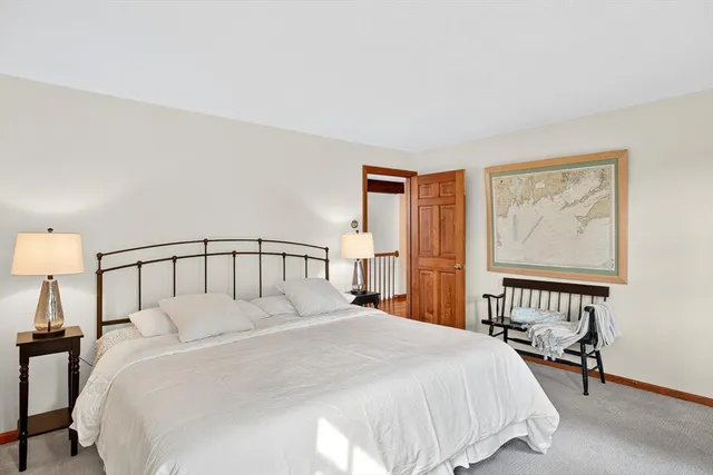 a bathroom with a granite countertop sink toilet and a mirror