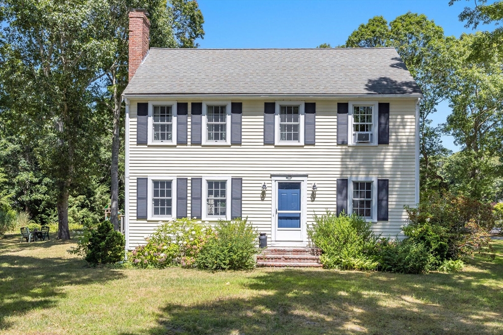 12 Tracy Road Barnstable, MA 02635 - Photo 5 of 42 a front view of a house with a yard