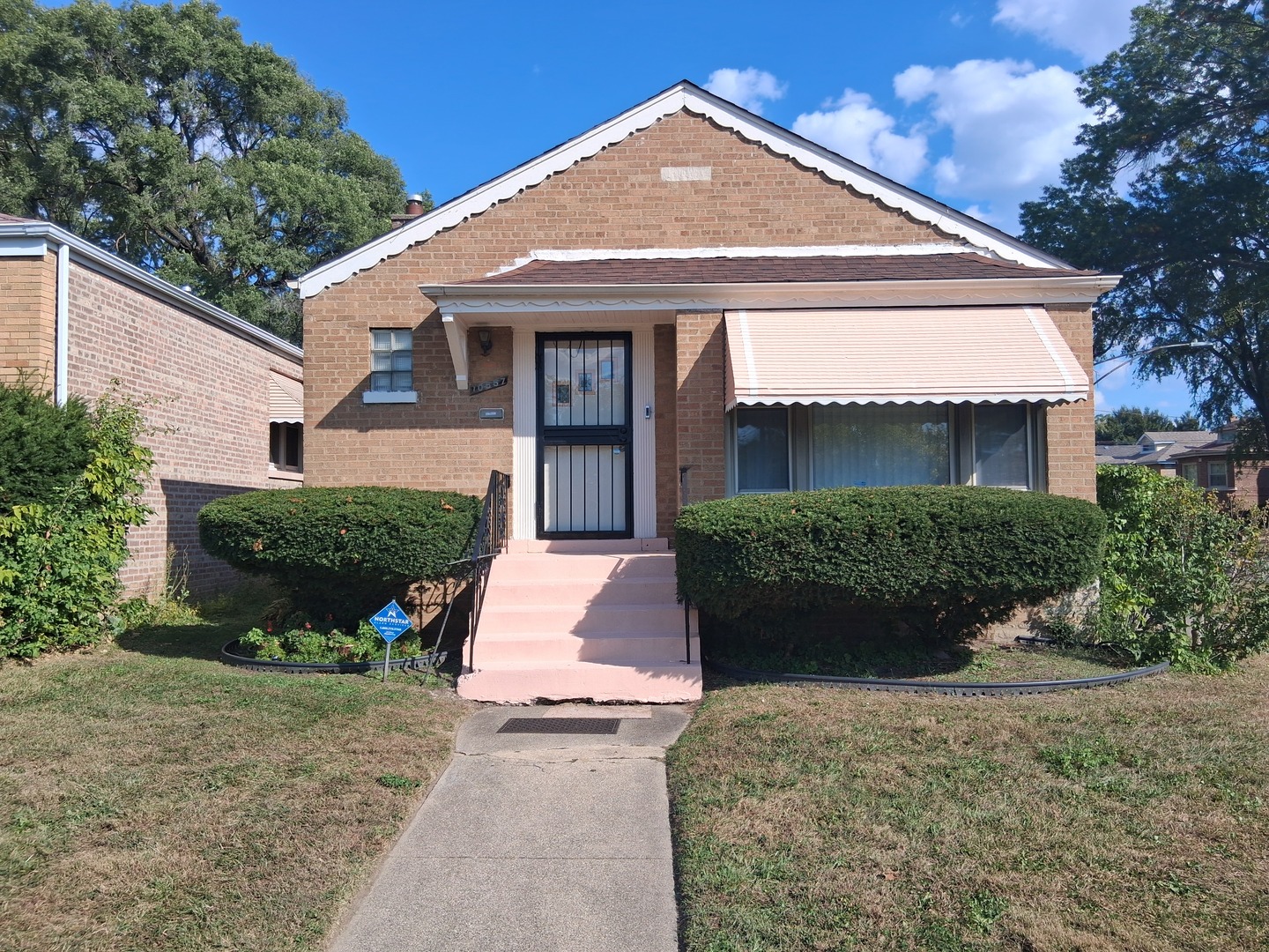 10557 South Racine Avenue Chicago, IL 60643 - Photo 1 of 20 a front view of a house with a yard