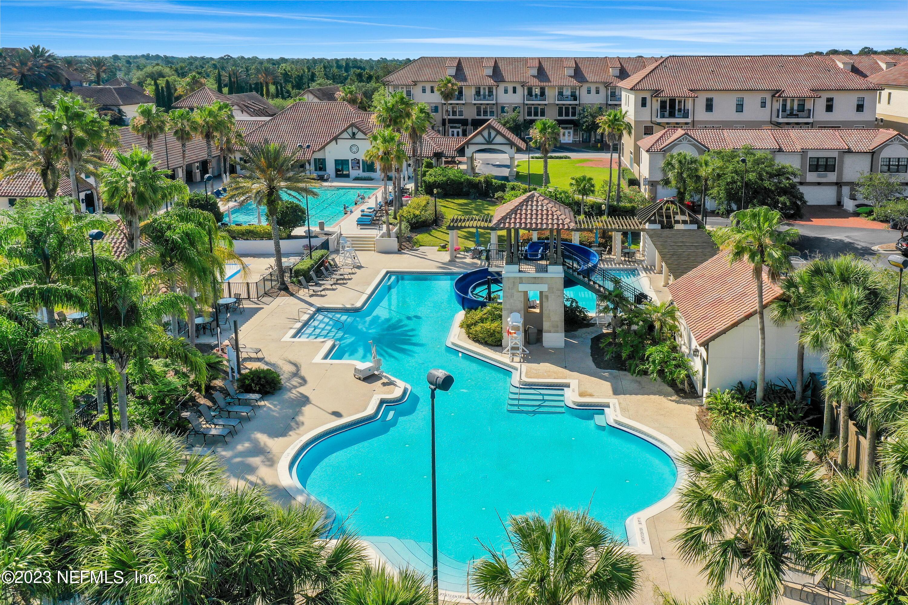 735 Promenade Pointe Drive St. Augustine, FL 32095 - Photo 17 of 22 an aerial view of a house with a garden and lake view