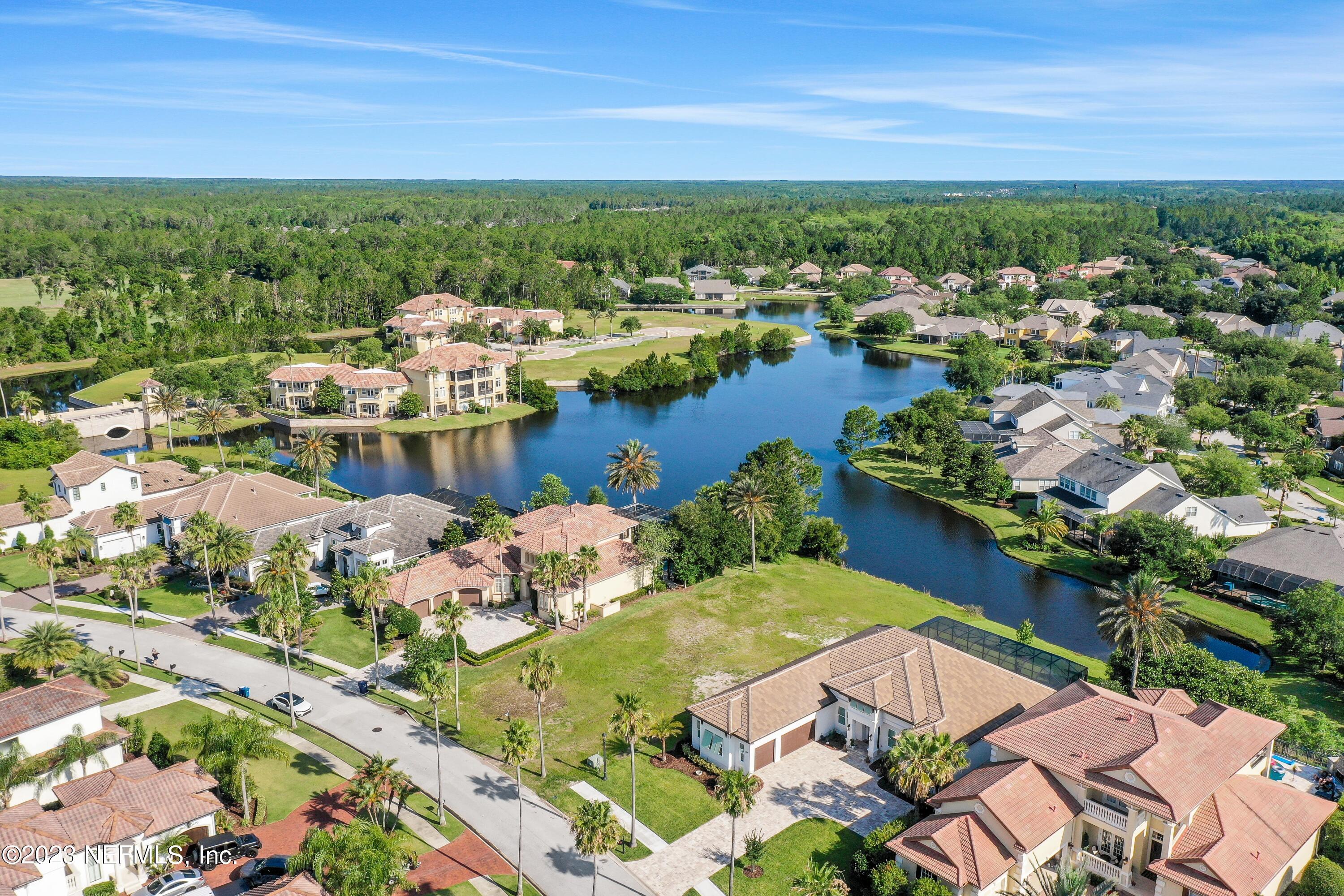 735 Promenade Pointe Drive St. Augustine, FL 32095 - Photo 3 of 22 a view of a lake with a houses