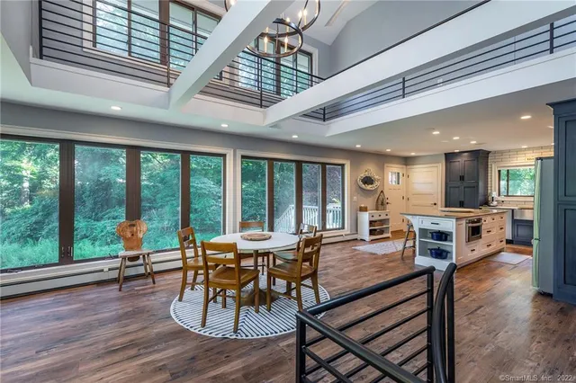 a view of a dining room with furniture window and wooden floor