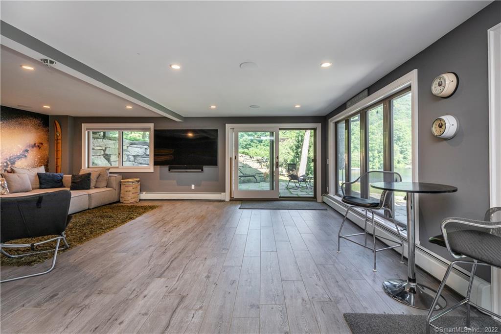 8 Cedar Point Drive Sherman, CT 06784 - Photo 18 of 30 a view of an empty room with wooden floor and windows
