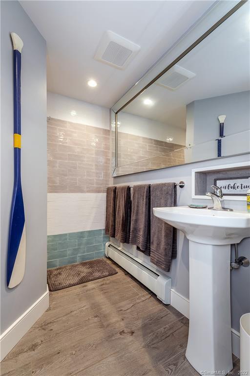 8 Cedar Point Drive Sherman, CT 06784 - Photo 21 of 30 a bathroom with a sink and a mirror