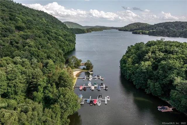an aerial view of a house with a lake view