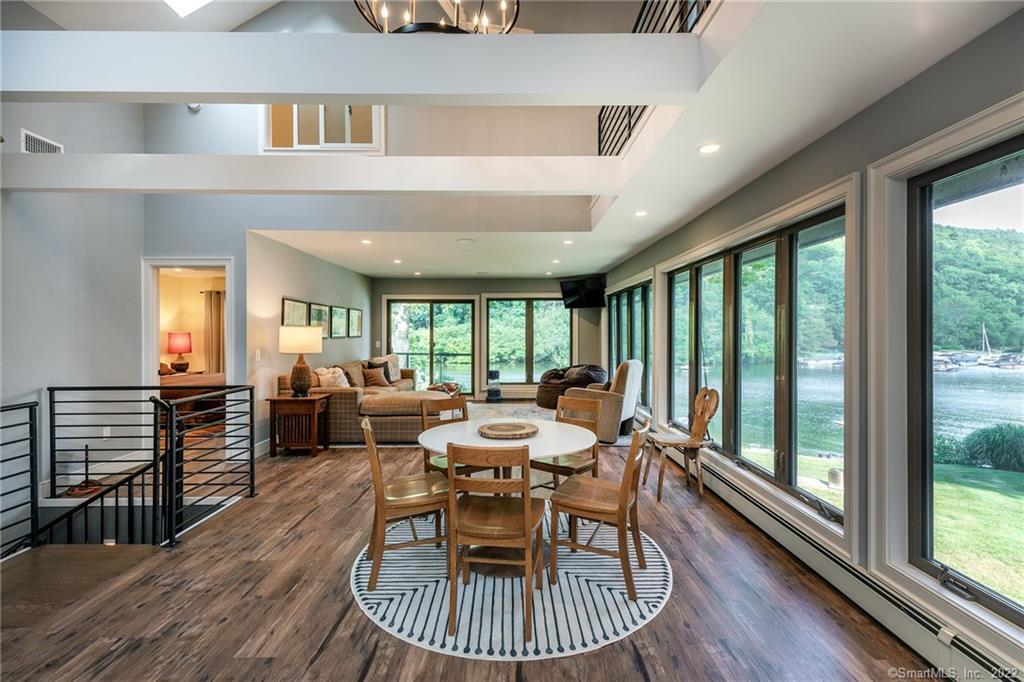 8 Cedar Point Drive Sherman, CT 06784 - Photo 28 of 30 a dining room with furniture a chandelier and wooden floor