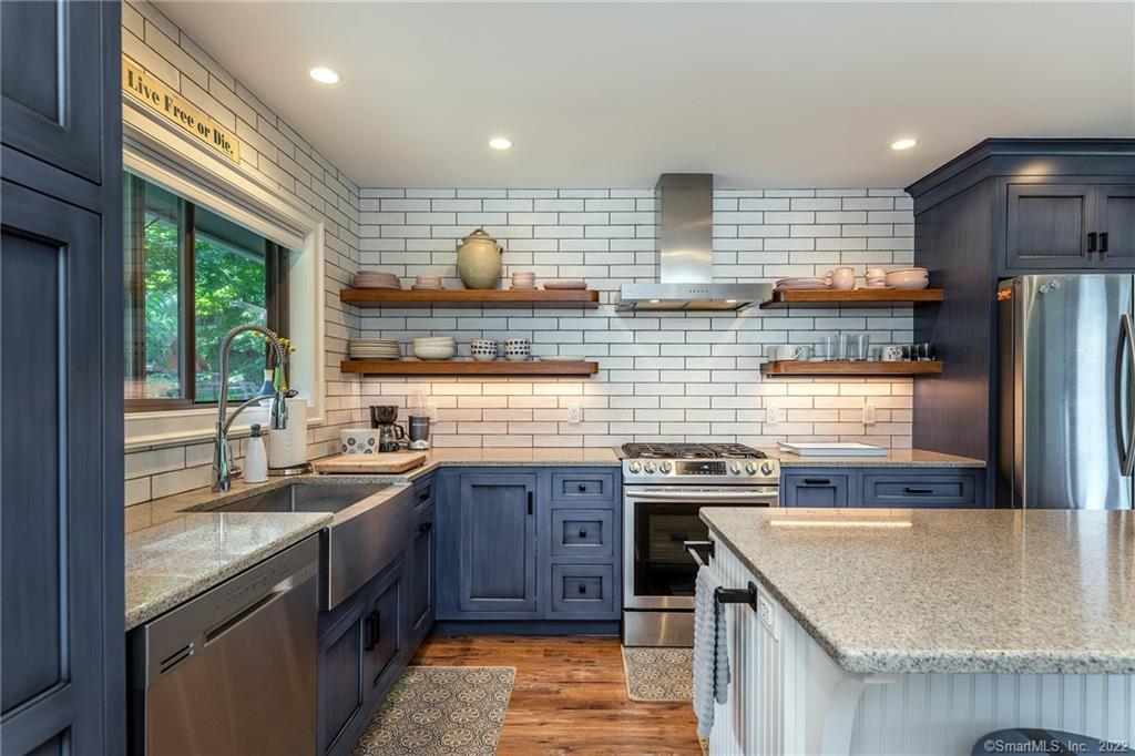 8 Cedar Point Drive Sherman, CT 06784 - Photo 29 of 30 a kitchen with stainless steel appliances granite countertop a sink stove and refrigerator