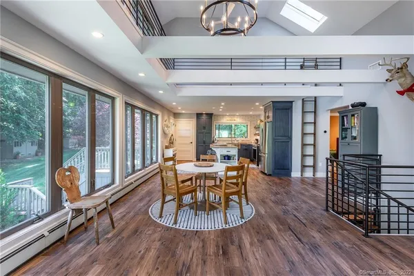 a view of a dining room with furniture window and wooden floor
