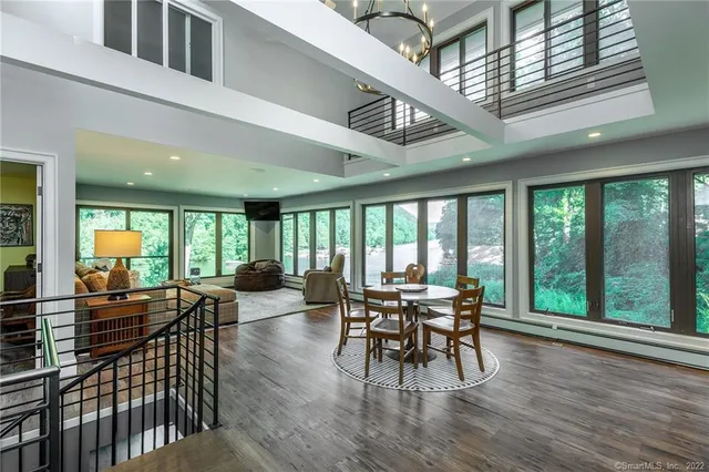 a view of a dining room with furniture window and outside view