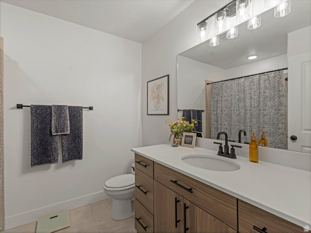 3047 Old Emigrant Road, Unit C Syracuse, UT 84075 - Photo 11 of 20 Bathroom with vanity, a shower with shower curtain, and light tile patterned floors